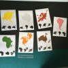 Montessori continent matching cards with colourful continents and black silhouettes on a dark background. Ideal for geography learning, Montessori activities, and homeschooling to build fine motor skills and cultural awareness.